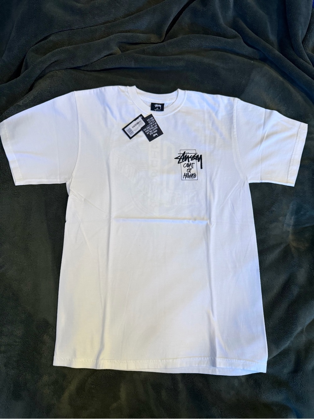 Stussy Men’s White Logo Chest T-Shirt “Coat Of Arms”